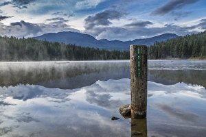 Mist on Lost Lake, Ski Hill and surrounding forest, Whistler, British Columbia, Canada Mist on Lost Lake, Ski Hill and surrounding forest, Whistler, British Columbia, Canada