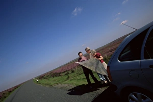 Motorists looking at the map, North Yorkshire Moors, Yorkshire, England Motorists looking at the map, North Yorkshire Moors, Yorkshire, England