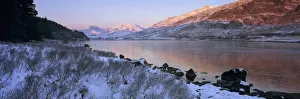 Mount Snowdon in snow at sunrise with frozen LLynnau Mymbyr lake, Capel Curig Mount Snowdon in snow at sunrise with frozen LLynnau Mymbyr lake, Capel Curig