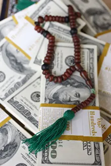 Muslim prayer beads and bank notes, France, Europe Muslim prayer beads and bank notes, France, Europe