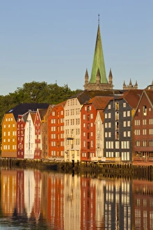 Nidaros Cathedral and old fishing warehouses reflected in the River Nidelva, Trondheim, Sor-Trondelag, Norway Nidaros Cathedral and old fishing warehouses reflected in the River Nidelva, Trondheim, Sor-Trondelag, Norway