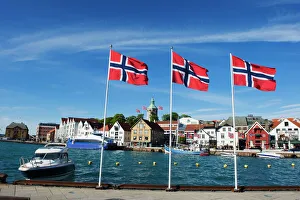 Norwegian flags and historic harbour warehouses, Stavanger, Norway, Scandinavia, Europe Norwegian flags and historic harbour warehouses, Stavanger, Norway, Scandinavia, Europe