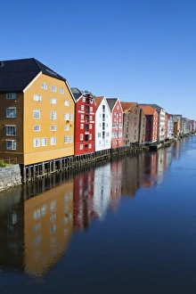 Old fishing warehouses reflected in the River Nidelva, Trondheim, Sor-Trondelag, Norway, Scandinavia, Europe Old fishing warehouses reflected in the River Nidelva, Trondheim, Sor-Trondelag, Norway, Scandinavia, Europe
