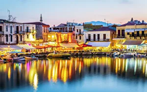 Old Venetian harbour, taverns on seaside at dusk, Rethymno (Rethymnon), Crete Old Venetian harbour, taverns on seaside at dusk, Rethymno (Rethymnon), Crete