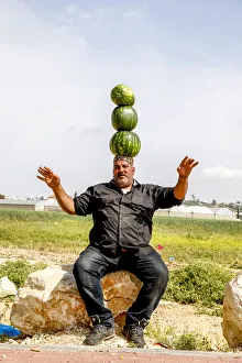 Palestinian selling watermelons at Al-Jalameh checkpoint on Israel-Palestine border Palestinian selling watermelons at Al-Jalameh checkpoint on Israel-Palestine border