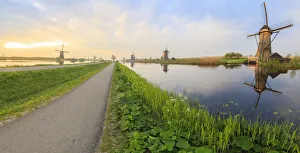 Panorama of the typical windmills reflected in the canals at dawn, Kinderdijk, UNESCO Panorama of the typical windmills reflected in the canals at dawn, Kinderdijk, UNESCO