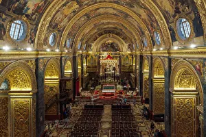 Prints of Panoramic interior view of Roman Catholic St. John Co-Cathedral with golden Maltese cross symbols on arches, Valletta, Malta, Europe Valletta Prints: Panoramic Print of St. John Co-Cathedral Interior with Golden Maltese Cross Symbols