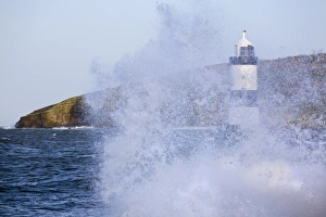 Prints of Penmon Point Lighthouse, built in 1838 at the northern entrance to the Menai Strait, and Puffin Island, with rough sea at high tide in winter, Penmon, Anglesey, Wales, United Kingdom, Europe Related Image Prints: Penmon Point Lighthouse Print, Anglesey Coastline