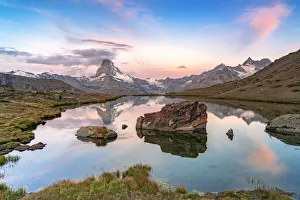 Pink sky at dawn over Matterhorn reflected in lake Stellisee, Zermatt, Valais Canton Pink sky at dawn over Matterhorn reflected in lake Stellisee, Zermatt, Valais Canton
