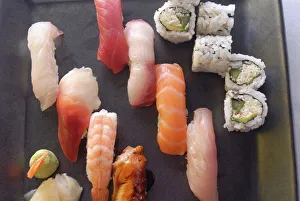 Plate of sushi covered with raw fish and stuffed Plate of sushi covered with raw fish and stuffed