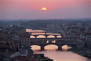 Prints of The Ponte Vecchio and other bridges over the River Arno at sunset in the city of Florence, Tuscany, Italy, Europe River Prints: Ponte Vecchio Print at Sunset over the River Arno in Florence