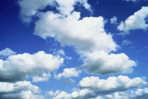English Countryside Scenery Prints: Puffy white clouds in a blue sky in England, United Kingdom, Europe
