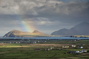 Rainbow over hills and dwellings, looking towards Clogher and Rosroe, Dingle Peninsula Rainbow over hills and dwellings, looking towards Clogher and Rosroe, Dingle Peninsula