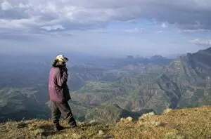 Simien National Park Collection: Ranger and mountain scenery, Simien Mountains National Park, UNESCO World Heritage Site