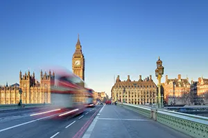 Red double-decker bus on Westminster Bridge, in front of the Palace of Westminster Red double-decker bus on Westminster Bridge, in front of the Palace of Westminster