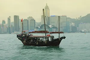 One of the last remaining Chinese junk boats sails on Victoria Harbour One of the last remaining Chinese junk boats sails on Victoria Harbour