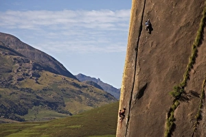 Two rock climbers making their way up a very difficult route on the 450 metre monolith of Karimbony Two rock climbers making their way up a very difficult route on the 450 metre monolith of Karimbony