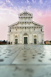 Romanesque facade of Pisa Cathedral (Duomo) under romantic sky at sunrise Romanesque facade of Pisa Cathedral (Duomo) under romantic sky at sunrise
