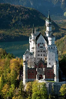 Romantic Neuschwanstein Castle and German Alps during autumn, southern part of Romantic Road Romantic Neuschwanstein Castle and German Alps during autumn, southern part of Romantic Road