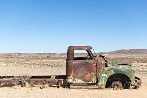 A rusty abandoned car in the desert near Aus in southern Namibia, Africa A rusty abandoned car in the desert near Aus in southern Namibia, Africa