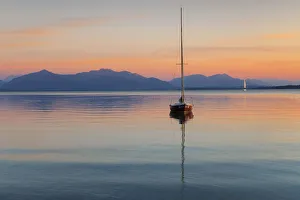 Sailing boat at sunset, Lake Chiemsee and Chiemgau Alps, Upper Bavaria, Germany, Europe Sailing boat at sunset, Lake Chiemsee and Chiemgau Alps, Upper Bavaria, Germany, Europe