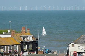 Sailing dinghy passes Broadstairs with Thanet Windfarm in background, Kent, England, United Kingdom, Europe Sailing dinghy passes Broadstairs with Thanet Windfarm in background, Kent, England, United Kingdom, Europe