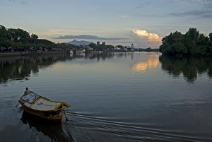 Sampan ferry on the Sarawak River in the centre of Kuching city at sunset Sampan ferry on the Sarawak River in the centre of Kuching city at sunset