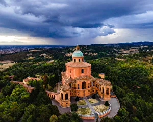 Sanctuary of Madonna di St. Luca, the symbol of Bologna, at sunset during a storm Sanctuary of Madonna di St. Luca, the symbol of Bologna, at sunset during a storm