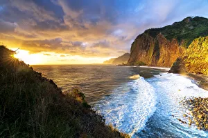 Scenic sky at dawn over waves crashing on cliffs, Madeira island, Portugal, Atlantic Scenic sky at dawn over waves crashing on cliffs, Madeira island, Portugal, Atlantic