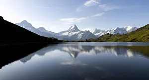 Schreckhorn mountain reflected in Bachalpsee lake at dawn, Grindelwald, Bernese Oberland Schreckhorn mountain reflected in Bachalpsee lake at dawn, Grindelwald, Bernese Oberland