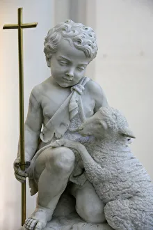 Sculpture depicting Christ as a good shepherd in Santa Maria D Sculpture depicting Christ as a good shepherd in Santa Maria D