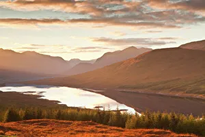The setting sun over Loch Loyne in the Scottish Highlands, Scotland, United Kingdom, Europe The setting sun over Loch Loyne in the Scottish Highlands, Scotland, United Kingdom, Europe