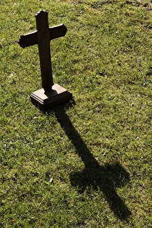 Shadow of a wooden cross on the lawn, St. Gervais-les-Bains, Haute-Savoie, France, Europe Shadow of a wooden cross on the lawn, St. Gervais-les-Bains, Haute-Savoie, France, Europe