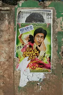 Images Dated 14th August 2005: Shahruk Khan in torn Bollywood movie poster on wall, Hospet, Karnataka, India, Asia