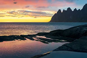 Midnight Sun Norway Prints: Sharp mountain peaks under the dramatic sky of midnight sun, Tungeneset viewpoint