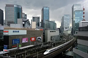 Shinkansen bullet train weaving through maze of buildings in the Yurakucho district of Shinkansen bullet train weaving through maze of buildings in the Yurakucho district of