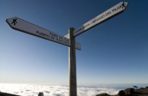 Blue Sky Travel Photography Prints: Signpost for trekkers above the clouds on top of the Taburiente, Canary Islands