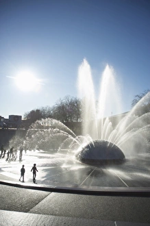 Silhouette of children playing in water fountain, Seattle Center, Seattle Silhouette of children playing in water fountain, Seattle Center, Seattle