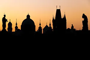 Silhouette of the old town buildings seen from Charles Bridge at sunrise, UNESCO World Silhouette of the old town buildings seen from Charles Bridge at sunrise, UNESCO World