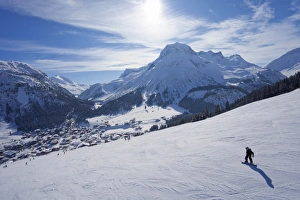Snow-boarder on piste at Lech near St. Anton am Arlberg in winter snow Snow-boarder on piste at Lech near St. Anton am Arlberg in winter snow