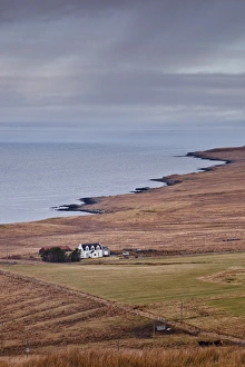 A solitary house sits on the north west coast of the Isle of Skye, Inner Hebrides, Scotland, United Kingdom, Europe A solitary house sits on the north west coast of the Isle of Skye, Inner Hebrides, Scotland, United Kingdom, Europe