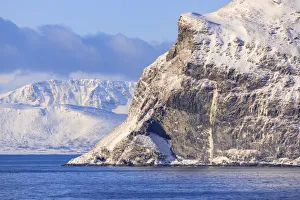 Spectacular snow covered mountains in winter, Troms islands, from the Norwegian Sea Spectacular snow covered mountains in winter, Troms islands, from the Norwegian Sea