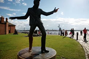 The statue of Billy Fury by Albert Dock and the Mersey River, Liverpool The statue of Billy Fury by Albert Dock and the Mersey River, Liverpool