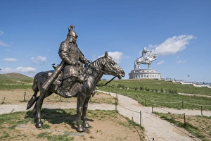 Statue of a Mongolian Empire warrior and Genghis Khan Statue Complex in the background Statue of a Mongolian Empire warrior and Genghis Khan Statue Complex in the background