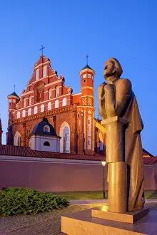 Prints of A Statue of the Polish Poet Adam Mickiewicz in front of St. Anne's Church and the Church of St. Francis and St. Bernard at Dusk, Vilnius, Lithuania Vilnius Prints: Adam Mickiewicz Statue Print, Vilnius Lithuania