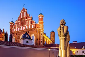 Prints of A Statue of the Polish Poet Adam Mickiewicz in front of St. Anne's Church and the Church of St. Francis and St. Bernard at Dusk, Vilnius, Lithuania Vilnius Prints: Adam Mickiewicz Statue Print at Dusk, Vilnius