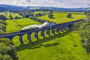 Steam locomotive crossing the Stanway Viaduct, Toddington, Gloucestershire, England Steam locomotive crossing the Stanway Viaduct, Toddington, Gloucestershire, England