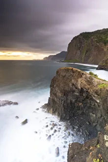 Storm clouds over the Atlantic Ocean and cliffs at dawn, Madeira island, Portugal Storm clouds over the Atlantic Ocean and cliffs at dawn, Madeira island, Portugal