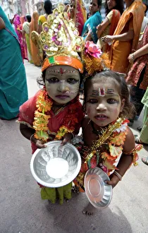 Two street children dressed in the style of Krishna at Diwali festival time Two street children dressed in the style of Krishna at Diwali festival time