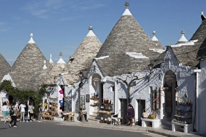 Street of of traditional trullos (trulli) in Alberobello, UNESCO World Heritage Site, Puglia, Italy, Europe Street of of traditional trullos (trulli) in Alberobello, UNESCO World Heritage Site, Puglia, Italy, Europe
